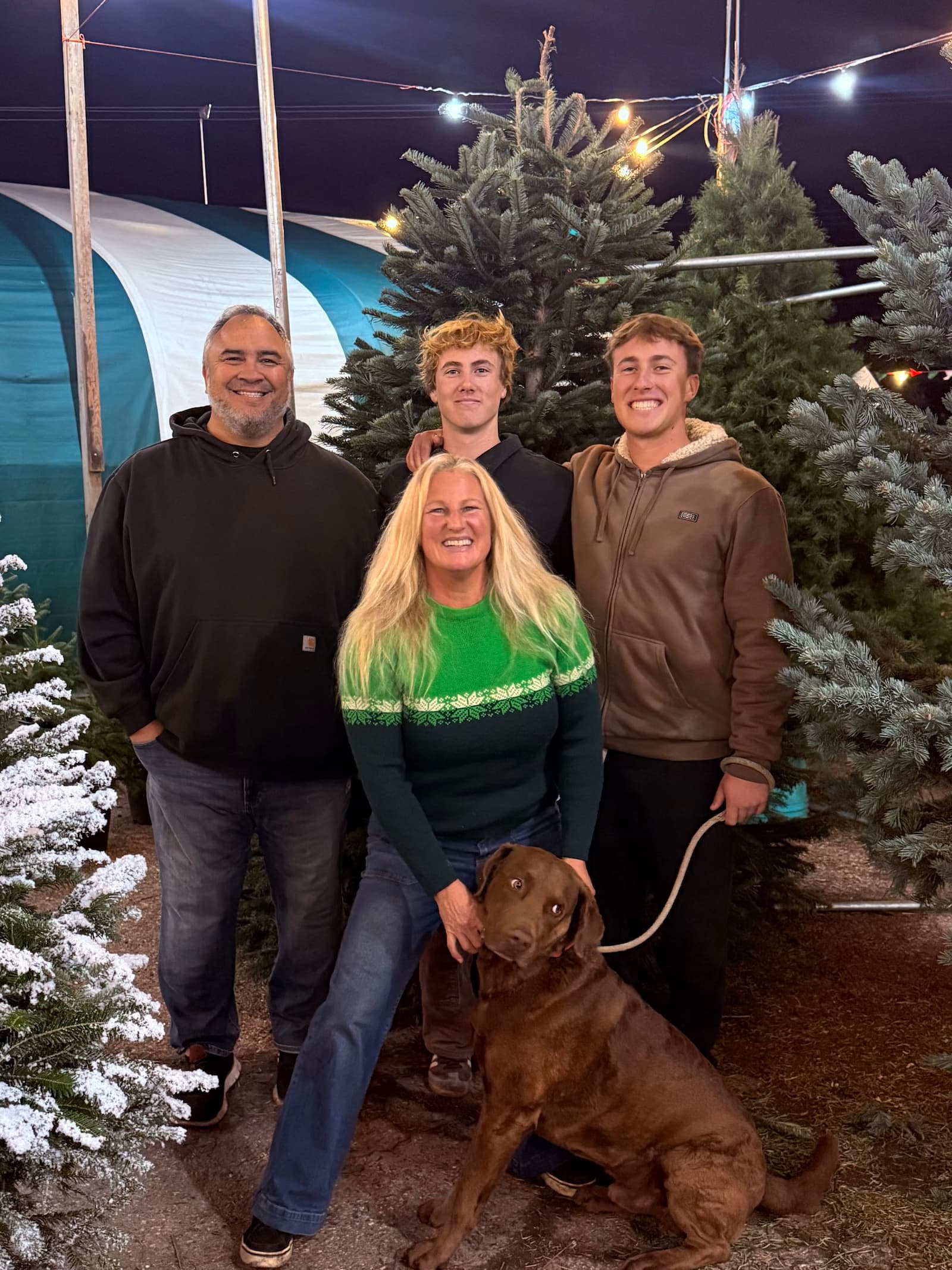 Simon Kurth with family at Christmas tree farm