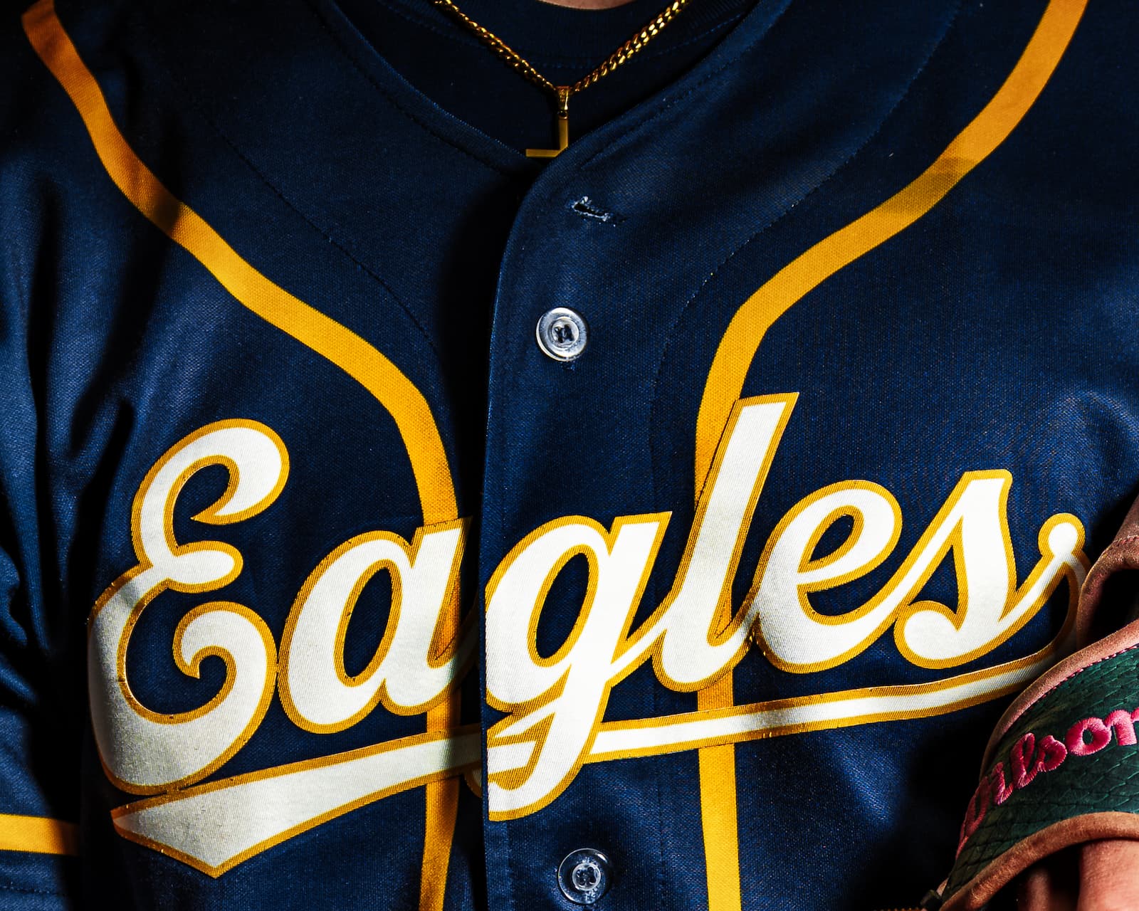 Eagles baseball jersey close-up with gold chain detail
