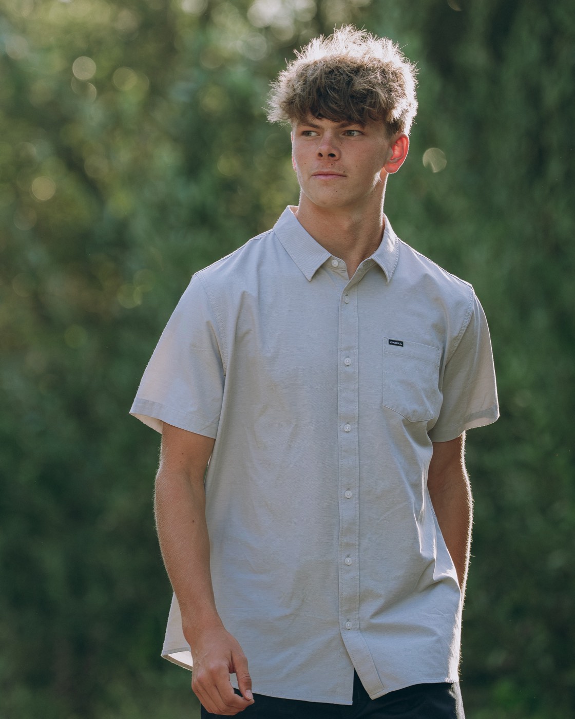Senior portrait, candid look in natural forest light — Central Coast senior photographer
