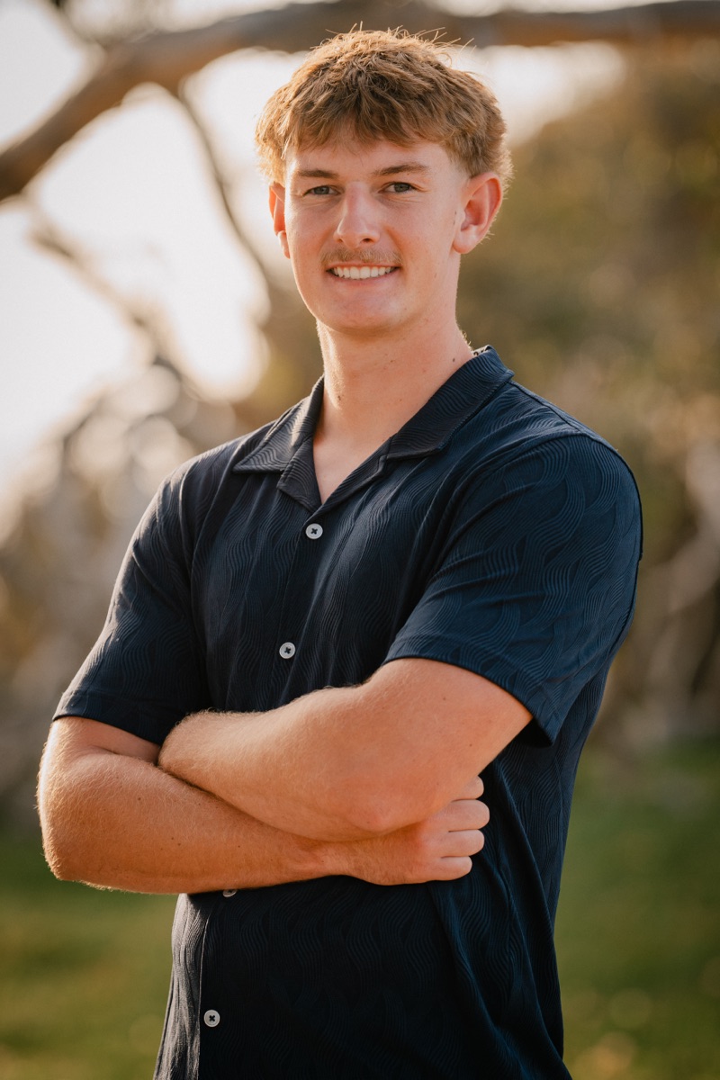 Senior boy portrait with arms crossed at golden hour — Central Coast senior photographer