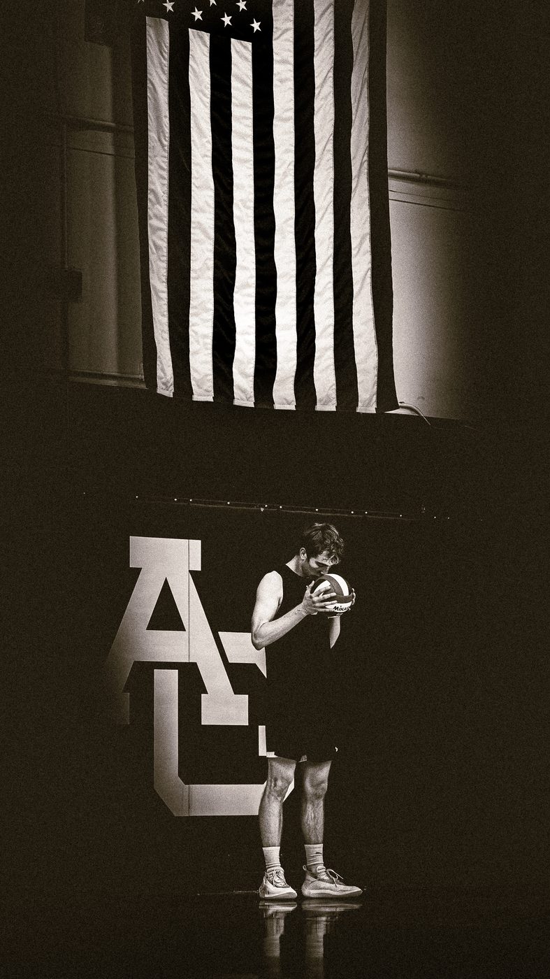 Basketball player under American flag, black and white