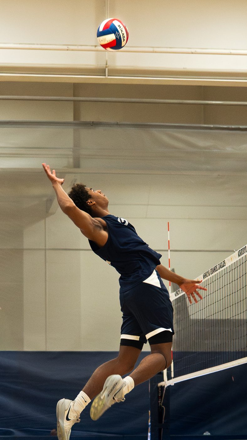 Volleyball player jumping to spike, Arroyo Grande Eagles