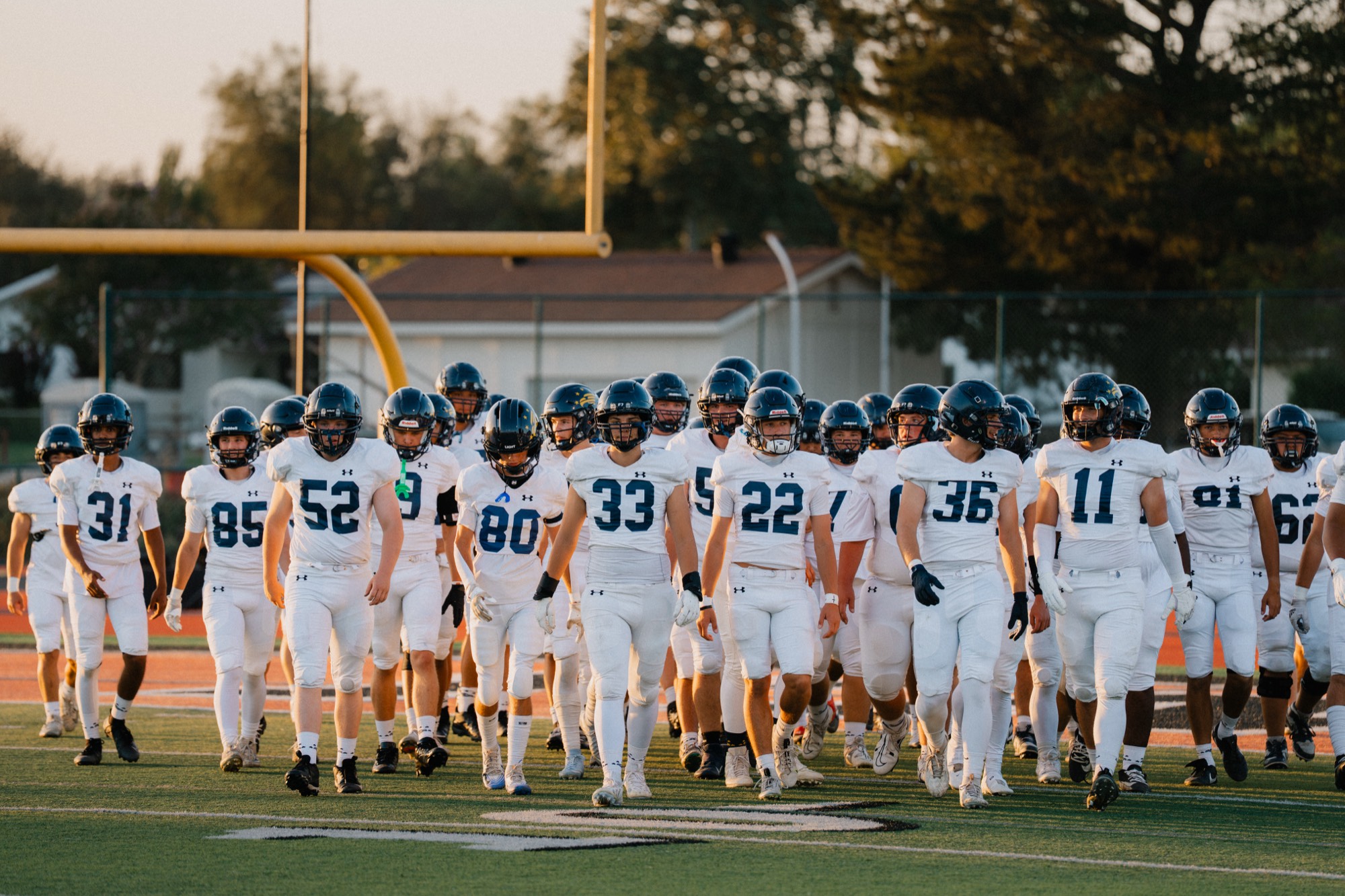Football team under the stadium lights, Central Coast California